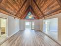 Open-concept living room boasts a ceiling fan and wood ceiling at 950 Sand Crest Dr, Port Orange, FL 32127