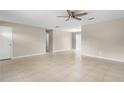 Open-concept living room features neutral walls, tile flooring, and seamless transition to other areas at 1043 Beulah Dr, Edgewater, FL 32132
