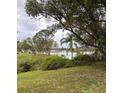 Beautiful lake view from the spacious backyard, perfect for outdoor activities and relaxation at 1774 Concert Rd, Deltona, FL 32738