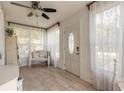 Inviting entryway with tile floors, lace curtains, and a bright, welcoming atmosphere at 254 Tanner St, New Smyrna Beach, FL 32168