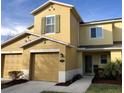 Charming two-story home with a one-car garage, neutral paint, and simple landscaping at 2669 Sicily Dr, New Smyrna Beach, FL 32168