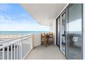 Balcony with seating provides spectacular ocean views and space to relax at 3047 S Atlantic Ave # B050, Daytona Beach, FL 32118