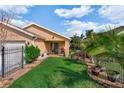 Private backyard featuring lush green lawn and mature tropical landscaping for relaxation at 3368 Tuscano Ne Ave, New Smyrna Beach, FL 32168