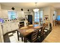 Traditional eat-in kitchen featuring a large, adjacent dining table and decorative black and white tile at 3656 Jackson St # A-2, Port Orange, FL 32129