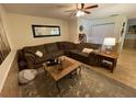 Comfortable living room boasting a plush sectional sofa, neutral tones and a stylish area rug at 3656 Jackson St # A-2, Port Orange, FL 32129