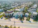 Aerial view of a charming home nestled in a vibrant neighborhood close to the beach at 604 S Atlantic Ave, New Smyrna Beach, FL 32169