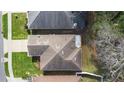Aerial view of a home showing the roof, landscaping, and surrounding neighborhood at 634 Coral Trace Blvd, Edgewater, FL 32132