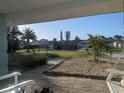 Charming view from the front porch showcasing the neighborhood and highlighting the proximity to the nearby lighthouse at 86 Rains Ct, Ponce Inlet, FL 32127