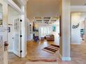 Bright and airy living room with wood floors and coffered ceiling at 905 Maple St, New Smyrna Beach, FL 32169