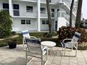 Relaxing courtyard featuring outdoor seating and tropical landscaping at 1111 Hill St # U27, New Smyrna Beach, FL 32169