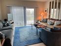 Cozy living room with comfortable seating and plenty of natural light at 1111 Hill St # U27, New Smyrna Beach, FL 32169