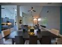 Open-concept living room with vaulted ceilings, projector screen, and seamless flow to the kitchen at 1948 Spruce Creek Lndg, Port Orange, FL 32128