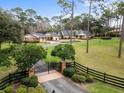 Gated entry, with manicured landscaping to compliment the stately home at 2333 Southern Pines Pl, Deland, FL 32724