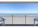Breathtaking oceanfront view from the balcony, showcasing the beach and horizon beyond railing at 2401 S Atlantic Ave # D301, New Smyrna Beach, FL 32169