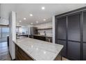 Modern kitchen features marble countertop, stainless steel appliances, and sleek cabinetry at 2401 S Atlantic Ave # D301, New Smyrna Beach, FL 32169