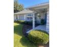 Close-up of a well maintained front exterior with landscaping at 2409 Victory Palm Dr, Edgewater, FL 32141