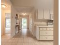 Inviting entryway with tile flooring, view of living area, and convenient access to the kitchen at 2626 Turnbull Estates Dr, New Smyrna Beach, FL 32168