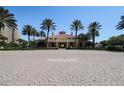 Expansive community center with classic architecture, surrounded by swaying palm trees at 265 Minorca Beach Way # 505, New Smyrna Beach, FL 32169