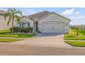 Attractive single-Gathering home with manicured lawn, tidy landscaping, and a neutral color palette at 2943 Gibraltar Blvd, New Smyrna Beach, FL 32168
