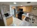 Well-equipped kitchen featuring stainless steel appliances and ample counter space at 3801 S Atlantic Ave # Ut125, New Smyrna Beach, FL 32169