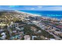 Scenic aerial of coastal neighborhood, showing proximity to car-free beach at 4035 Saxon Dr # A3, New Smyrna Beach, FL 32169