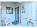 Welcoming covered porch with seating area, providing a relaxing outdoor space at 4322 Sea Mist Dr # 4322, New Smyrna Beach, FL 32169