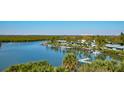 Breathtaking water view with palms, condos, mangroves, and docks at 5 Riverwalk Dr # 506, New Smyrna Beach, FL 32169