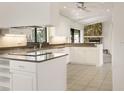 Modern kitchen featuring white cabinets and stainless steel appliances at 55 Bay Harbour Dr, Ponce Inlet, FL 32127