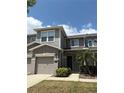 Two story townhome with a neutral color palette, covered entryway and attached garage at 612 Mount Olympus Blvd, New Smyrna Beach, FL 32168