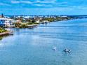 Aerial image showcasing kayakers on a bay in a coastal neighborhood at 6584 Engram Rd # 405, New Smyrna Beach, FL 32169