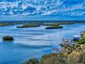 Scenic aerial view overlooking a bay with lush mangrove islands and dock at 6584 Engram Rd # 405, New Smyrna Beach, FL 32169