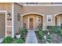 The inviting entryway is beautifully landscaped with a walkway to the front door at 94 Bella Vita Way, Ormond Beach, FL 32174