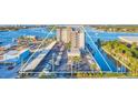 Overhead shot of the condo by the bay highlighting parking, boat docks, and community layout at 101 N Riverside Dr # 214, New Smyrna Beach, FL 32169