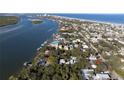Aerial view showcasing the home's proximity to the water and nearby coastal community at 111 Esther St, New Smyrna Beach, FL 32169