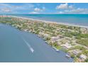 Beautiful beach community with homes lining the canal and oceanfront at 1194 N Peninsula, New Smyrna Beach, FL 32169