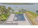 Overhead view of a luxury waterfront pool and deck area at 1194 N Peninsula, New Smyrna Beach, FL 32169