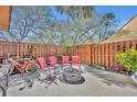 Private fenced patio with seating area and fire pit, perfect for enjoying outdoor relaxation and gatherings at 135 Cedar Dunes Dr, New Smyrna Beach, FL 32169