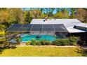 Enjoy a large screened in pool and patio for outdoor entertaining at 1370 Jane Lacey Ln, New Smyrna Beach, FL 32168