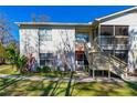Condo exterior showing neat landscaping, a private entrance, and well-lit pathway at 1600 Big Tree Rd # G3, South Daytona, FL 32119