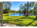 Scenic pond view surrounded by lush greenery, offering a tranquil setting at 1600 Big Tree Rd # G3, South Daytona, FL 32119