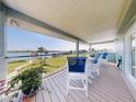 A spacious balcony with seating that offers tranquil waterfront views at 2019 S Riverside, Edgewater, FL 32141