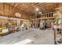 Spacious barn interior with high ceilings, basketball hoop, and ample storage space at 2533 Glenhaven St, New Smyrna Beach, FL 32168