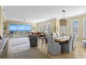 Open-concept living and dining area with stunning ocean views and stylish furnishings at 261 Minorca Beach Way # 606, New Smyrna Beach, FL 32169