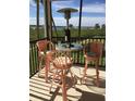 Screened balcony seating area with heater and marina views at 2700 N Peninsula Ave # 113, New Smyrna Beach, FL 32169