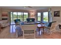 Bright and spacious living room with comfortable seating and water views at 2700 N Peninsula Ave # 113, New Smyrna Beach, FL 32169