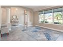 Bright living room with tile flooring and large windows offering plenty of natural light and open floor plan at 2908 Cypress Ridge Trl, Port Orange, FL 32128