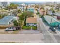 Aerial view of coastal home with turquoise accents, close proximity to the beach at 301 N Cooper St, New Smyrna Beach, FL 32169