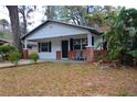 Charming home with a welcoming porch, set amidst a lush, green landscape at 349 Fletcher Ave, Daytona Beach, FL 32114