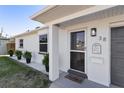Welcoming front entrance featuring a storm door and decorative accents at 38 Seacrest Dr, Ormond Beach, FL 32176