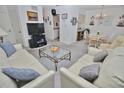 Cozy living room featuring comfortable seating and view of the adjacent dining area at 4225 S Atlantic Ave # 2070, New Smyrna Beach, FL 32169